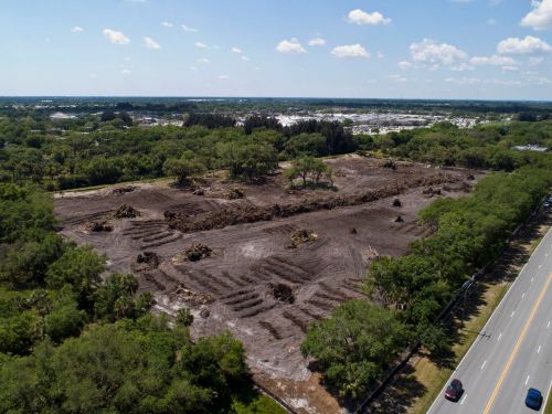 Aerial view of empty lot after land clearing